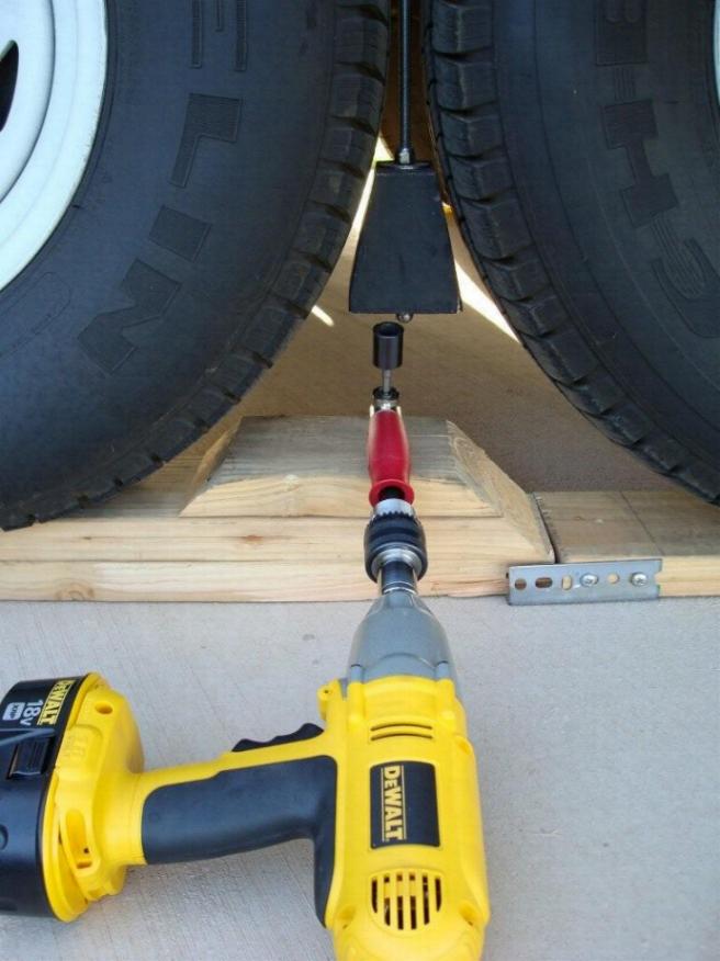 Picture shows the Cowan Chuck being used in a new big rig tire locking device.