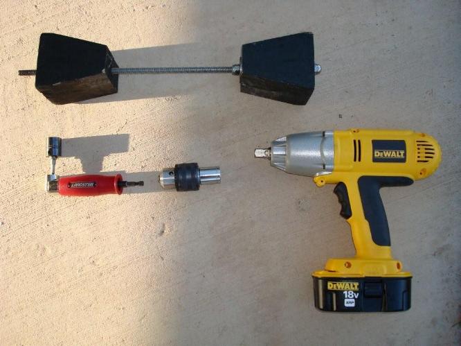 This picture shows the tools needed to use to secure a truck from moving using a Cowan Chuck and an impact wrench.